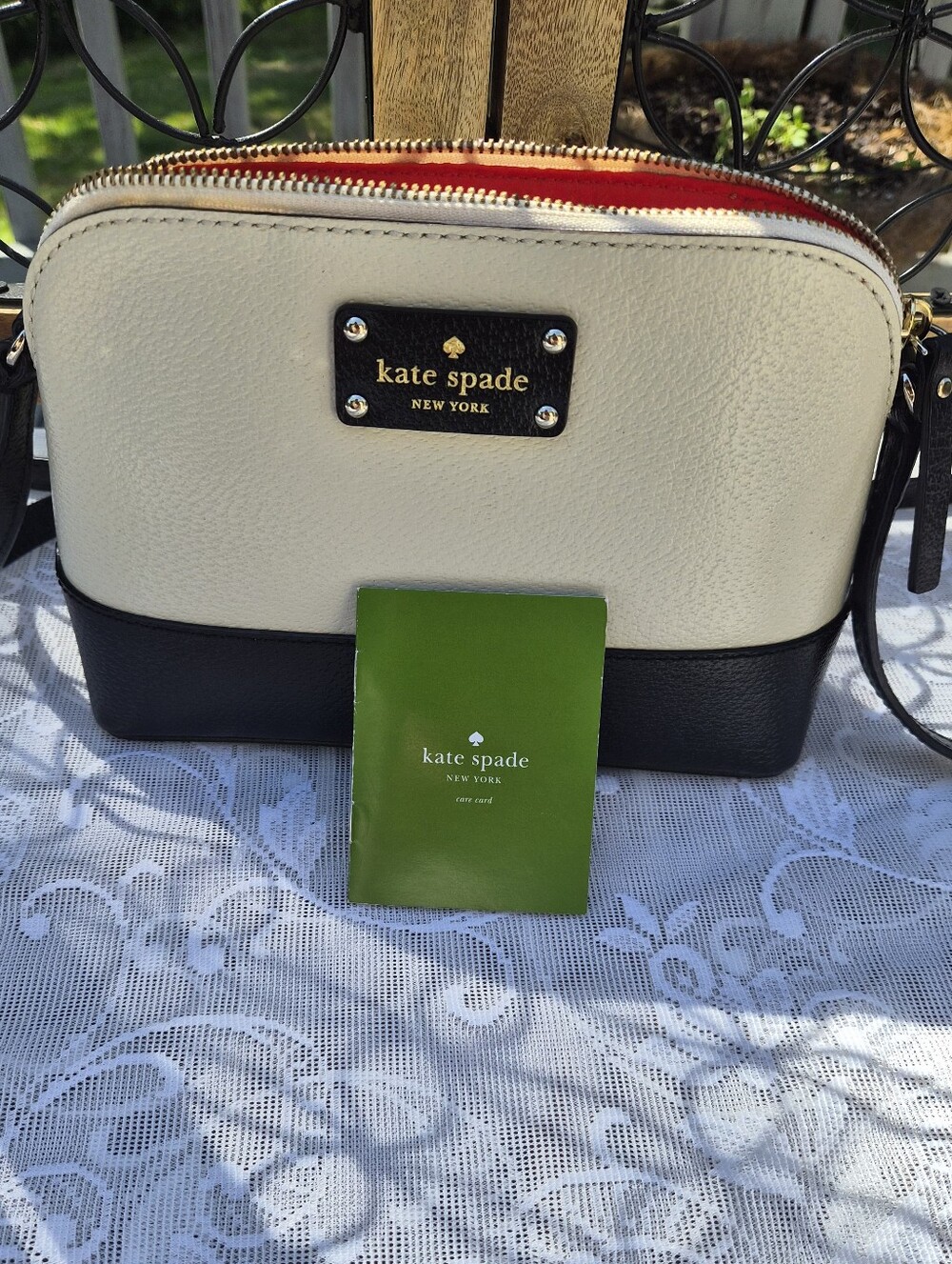 Kate Spade Cream and Black Two Toned Pebbled Leather Crossbody With Red Interior